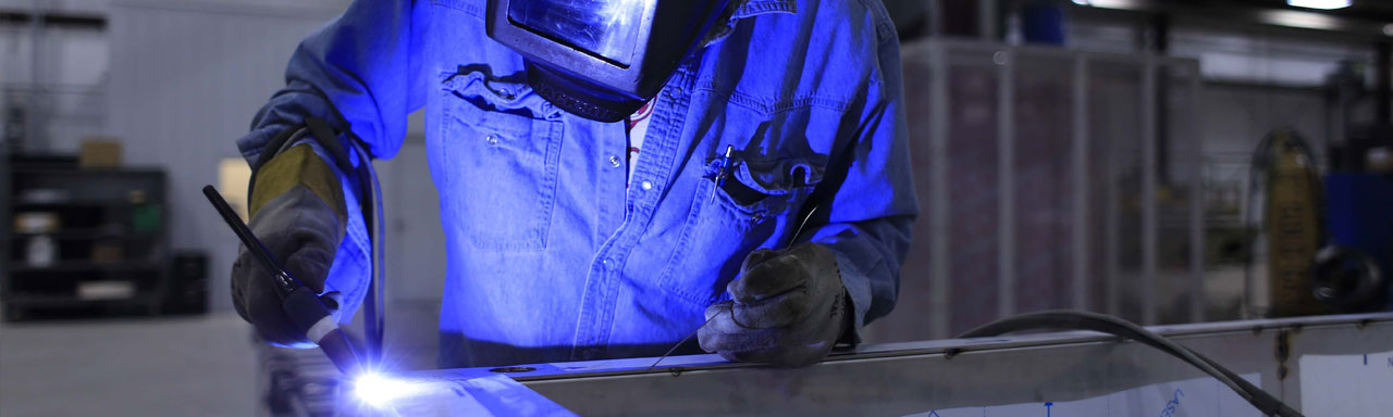 welder in manufacturing plant