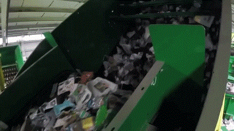 Paper and fiber being removed from the Green Machine.