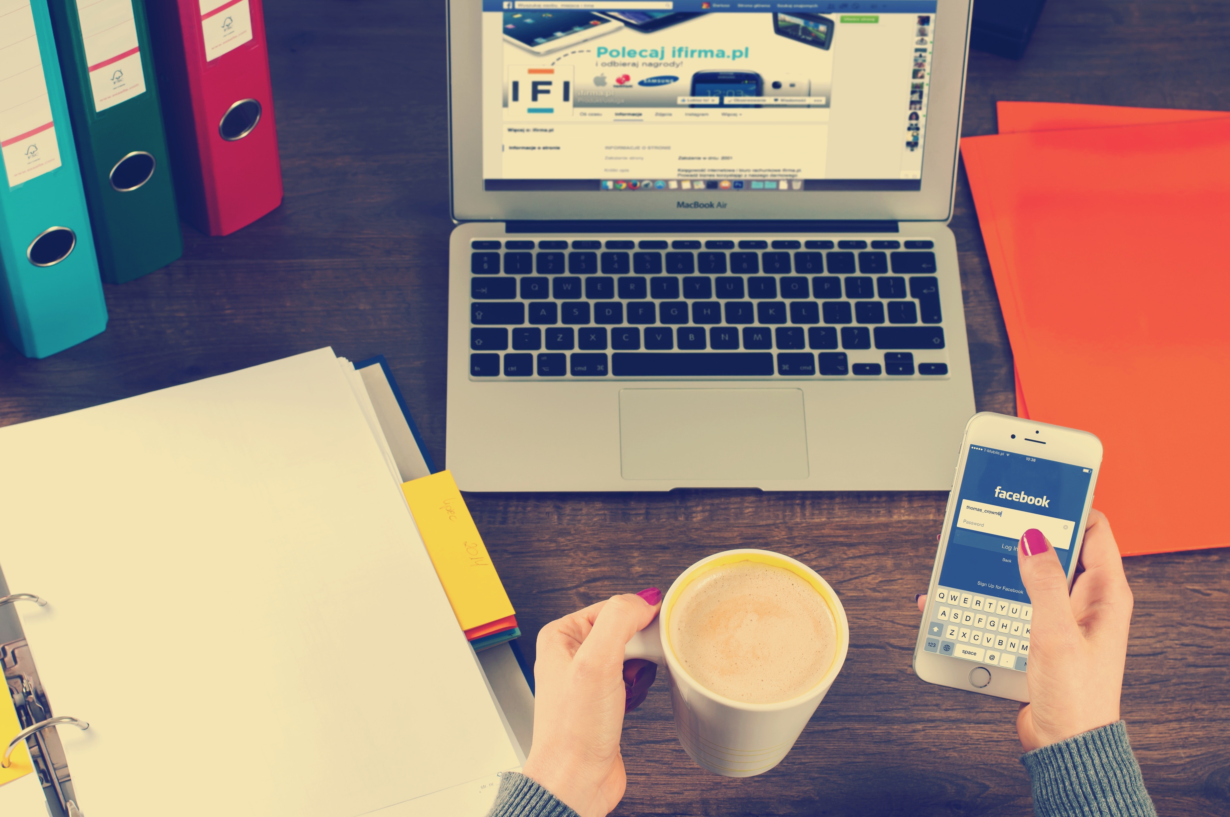 desk with coffee mug and laptop