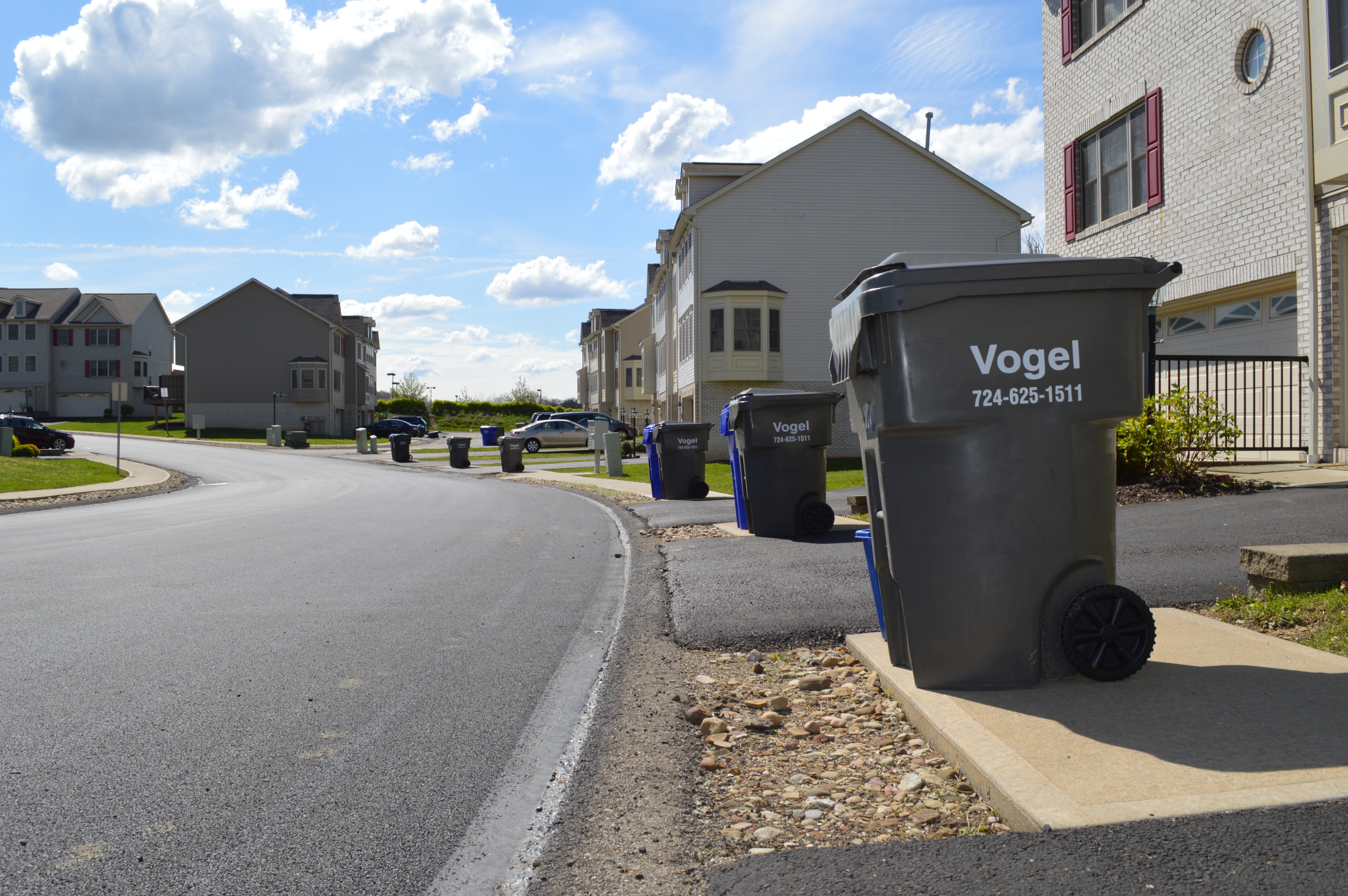 Vogel Holding dumpster in suburban neighborhood