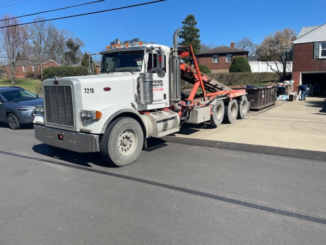 Penn Waste dumpster delivery truck