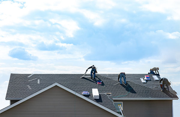 crew installing new roof