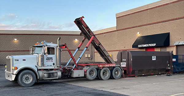 Penn Waste dumpster delivery via truck 