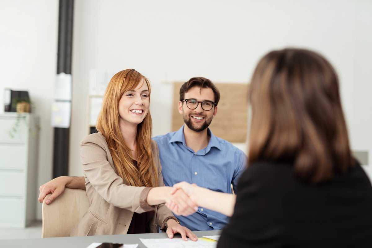 young couple being approved for a loan