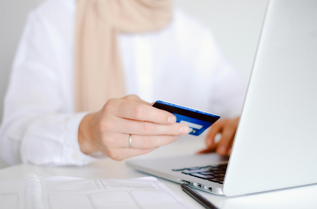 woman using credit card for an online purchase