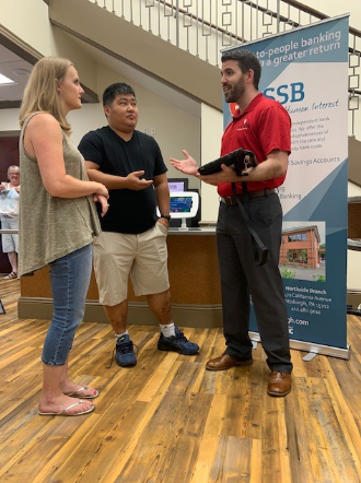 ssb bank employee speaking to family