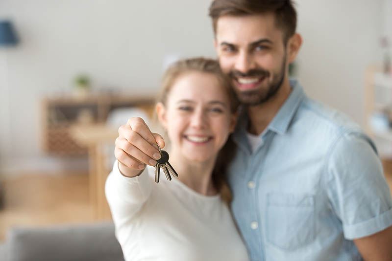 couple with new house keys